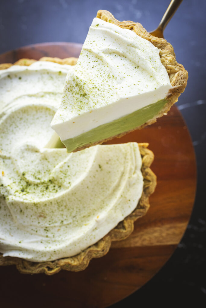 Matcha pie slice with golden crust and whipped topping, captured by Cyntia Apps, San Francisco Food Photographer.