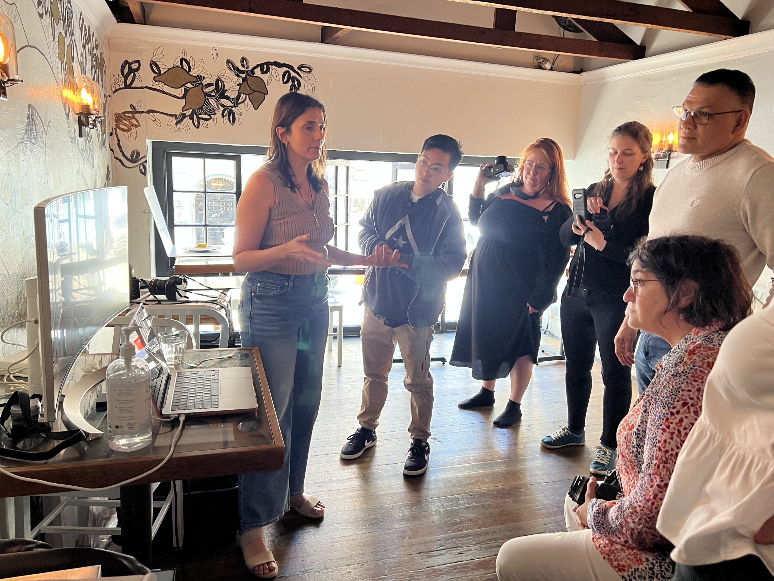 Group portrait of Savor The Light workshop attendees with Cyntia Apps, San Francisco Bay Area culinary photographer, at Bouche SF during a natural light food photography workshop.