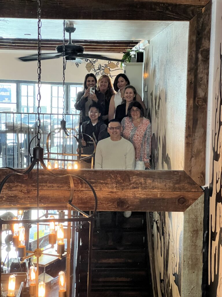 Group photo of Savor the Light workshop attendees with Cyntia Apps at Bouche SF, celebrating a day of creative connection and growth.photography community, Bay Area food creatives, workshop recap, Savor the Light San Francisco, food photographer Cyntia Apps
